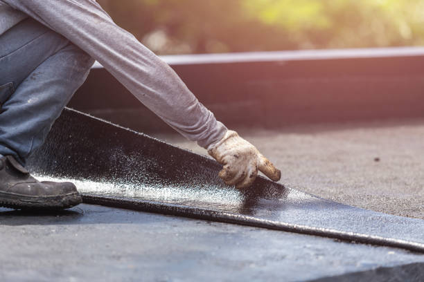 Professional Basement Waterproofing technician working in Harvest, AL